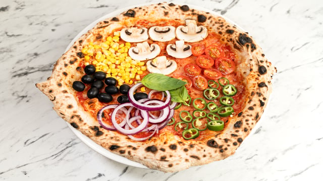 Wood-fired pizza loaded with fresh toppings